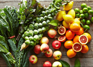 a group of fruits and vegetables on a wood surface Healthy Weight Loss Diets Henley-on-Thames