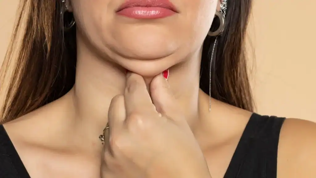 An image of a woman with double chin, sad, worried : Non Surgical Double Chin Removal Treatment in Henley-on-Thames, UK